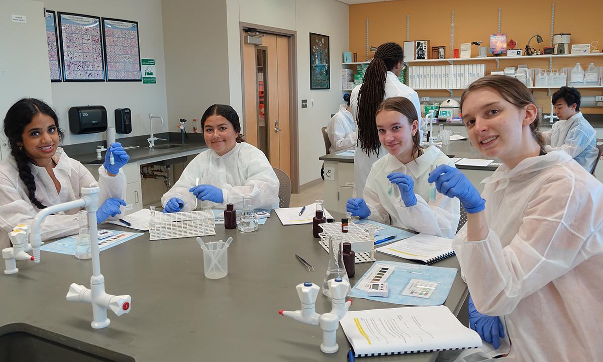 A group of students participate in activities in the lab